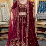 Rosewood maroon bridal lehenga with blouse and dupatta, front view on display