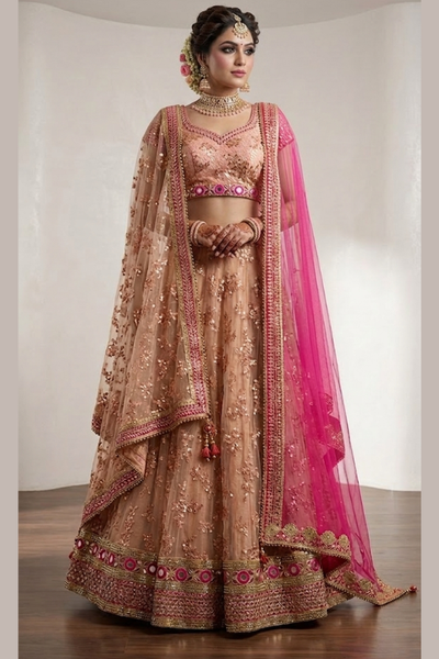 Bride in blush peach bridal lehenga with hot pink dupatta, front view