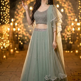 Dusty mint embellished lehenga portrait with lantern, festive light backdrop