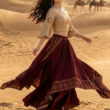 Wine and beige Indo-Western skirt set with bell sleeves, mid-motion pose