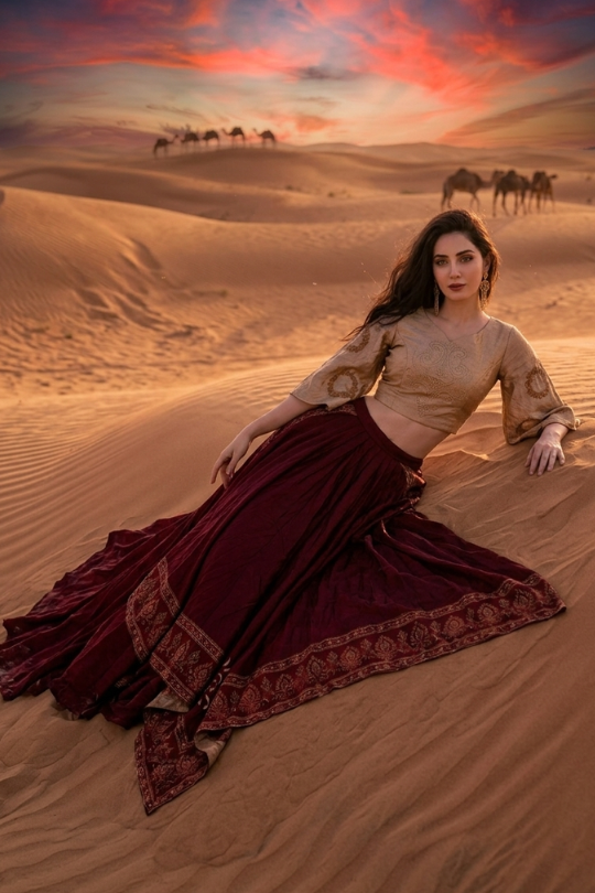 Wine and beige draped skirt set against a desert sunset backdrop
