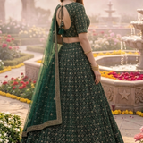 Emerald green lehenga side view showing geometric embroidered skirt