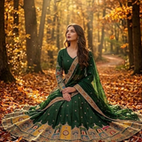 Model seated wearing Emerald Green Embroidered Lehenga Set