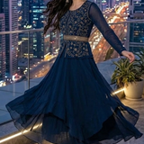 Midnight blue layered skirt set side view showing flowy drape