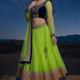 Neon lime lehenga with navy embroidered border, front pose
