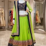 Neon lime and navy blue designer lehenga, front view on display