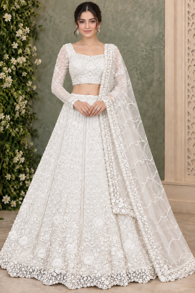 Pearl white bridal lehenga with sheer sleeves and floral embroidery, front pose