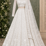 Pearl white floral embroidered bridal lehenga, front view on display