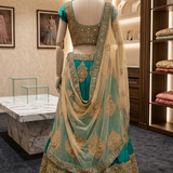 Rama green gold lehenga back view on display showing blouse design