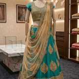Rama green and gold embroidered lehenga, front view on display
