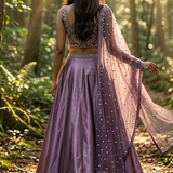 Amethyst lehenga back view showing net dupatta with embellishments
