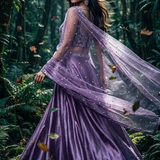 Royal amethyst lehenga side view with flowing net dupatta