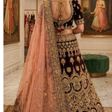 Maroon and peach bridal lehenga back view showing dupatta drape and embroidery