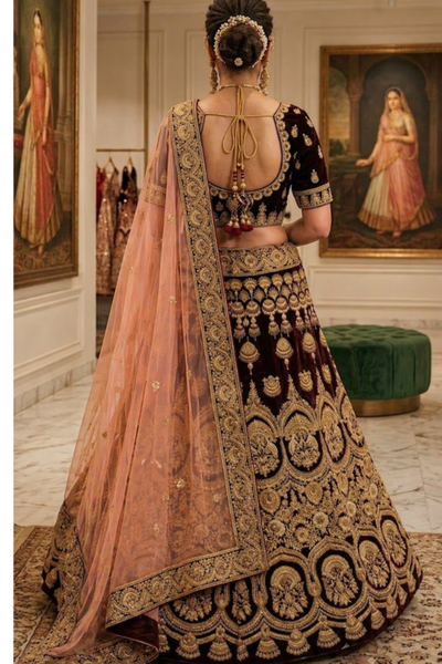 Maroon and peach bridal lehenga back view showing dupatta drape and embroidery
