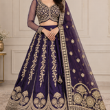 Bride in royal purple zari embroidered bridal lehenga with sheer dupatta, front view