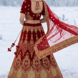 Red velvet bridal lehenga back view showing blouse and dupatta detailing