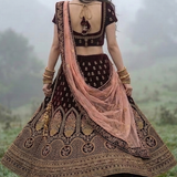 Model wearing Royal Wine Embroidered Lehenga Set Back View