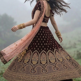 Twirl view of Royal Wine Embroidered Lehenga with blush pink dupatta