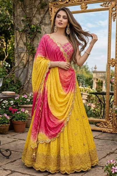 Sunset Yellow Lehenga featuring draped pink ombre dupatta