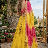 Model wearing Sunset Yellow Ombre Lehenga Set back view