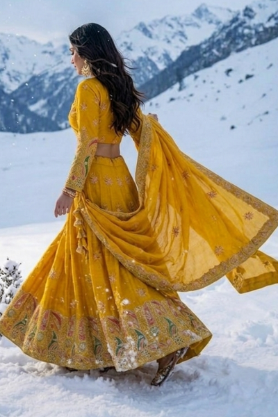 Sunshine Royale mustard lehenga set side view with draped dupatta and flared skirt