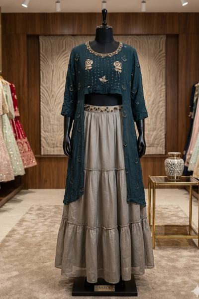 Teal embroidered kurta with grey flared skirt, front view on display