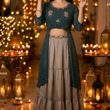Woman in teal embroidered Indo-Western kurta skirt set, standing among lanterns
