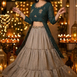Woman in teal kurta skirt set in motion, festive lantern setting