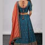 Teal lehenga back view showing blouse design and dupatta drape