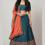 Teal blue lehenga with rust orange dupatta, front view