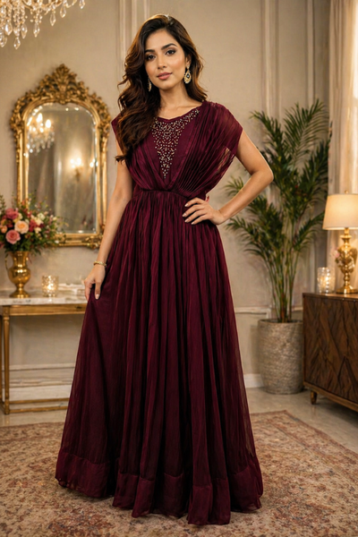 Woman in wine maroon evening gown with embellished bodice, front view