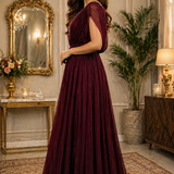 Wine maroon evening gown side view showing flared silhouette